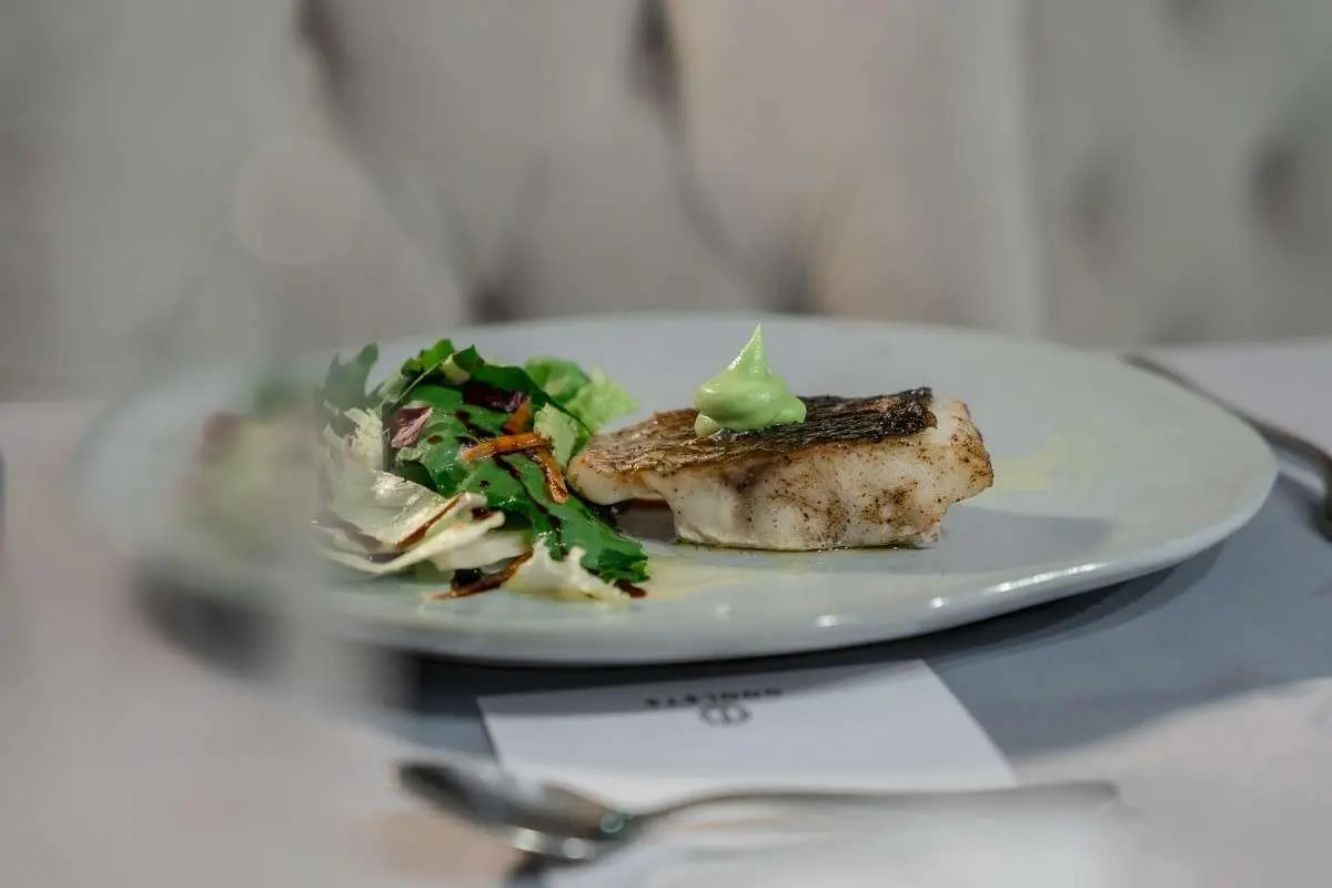 Two plated dishes on a table aboard Cristal yacht, light meal setup