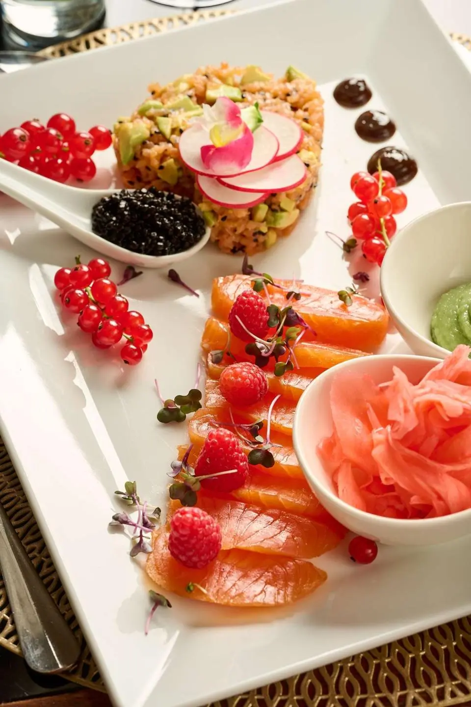Queen Eleganza yacht dining scene with fruit desserts and plates