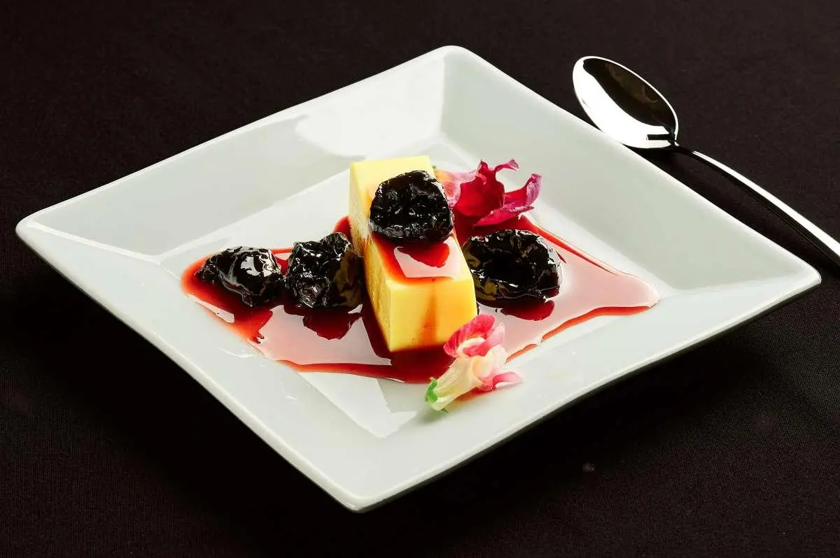 Yacht Luna dessert plate with berry sauce and fluted pastry square on white dish