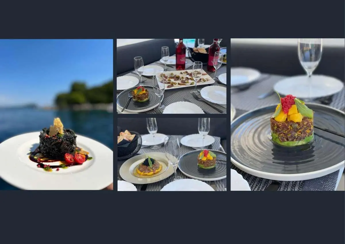 View of a yacht charter meal service on board with plates and drinks