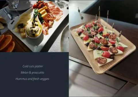Cold cuts platter with melon, prosciutto, hummus and fresh veggies on a yacht tasting menu