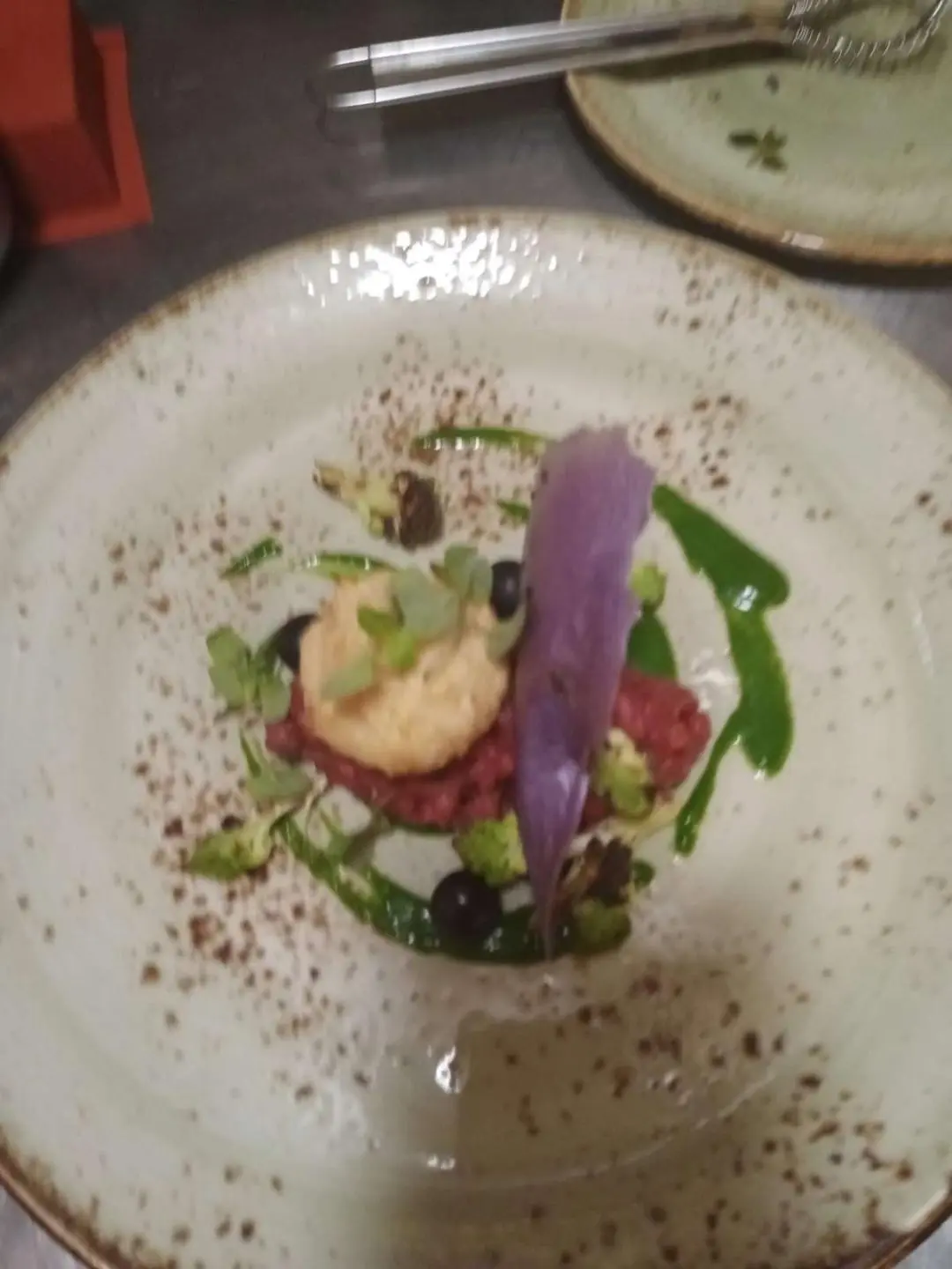Genny yacht charter: close-up plate with decorative edible garnishes on a dish