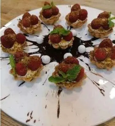 Cartouche yacht menu platter with bite-sized appetizers arranged on white plate