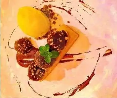 Gourmet dessert plate with mango mille-feuille and berry compote on a white plate