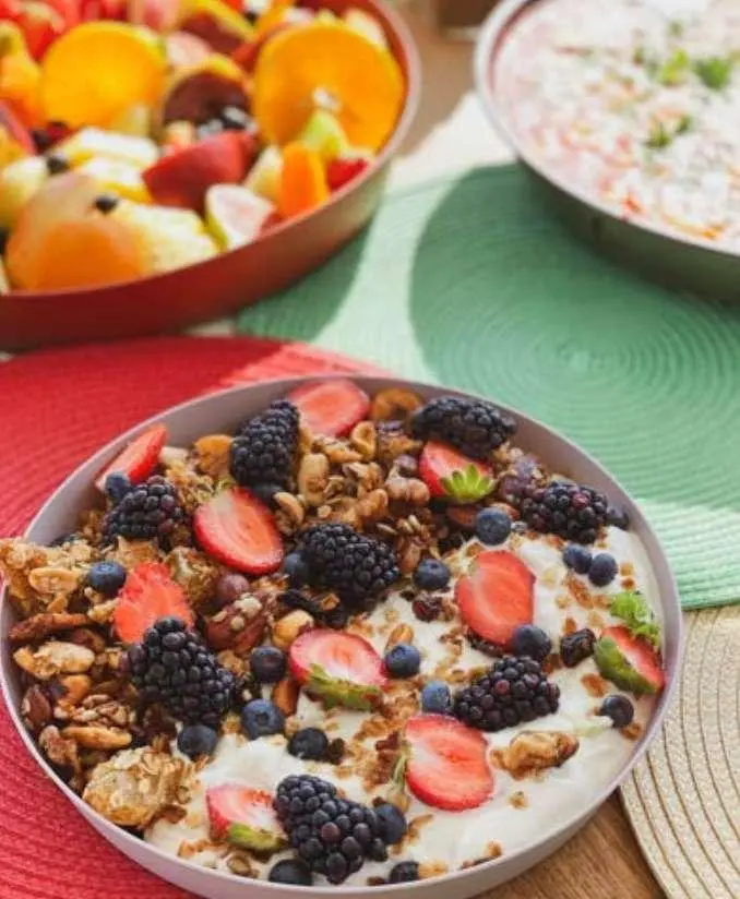 Ocean Lounge yacht deck with fruit bowls and a chocolate breakfast pastry