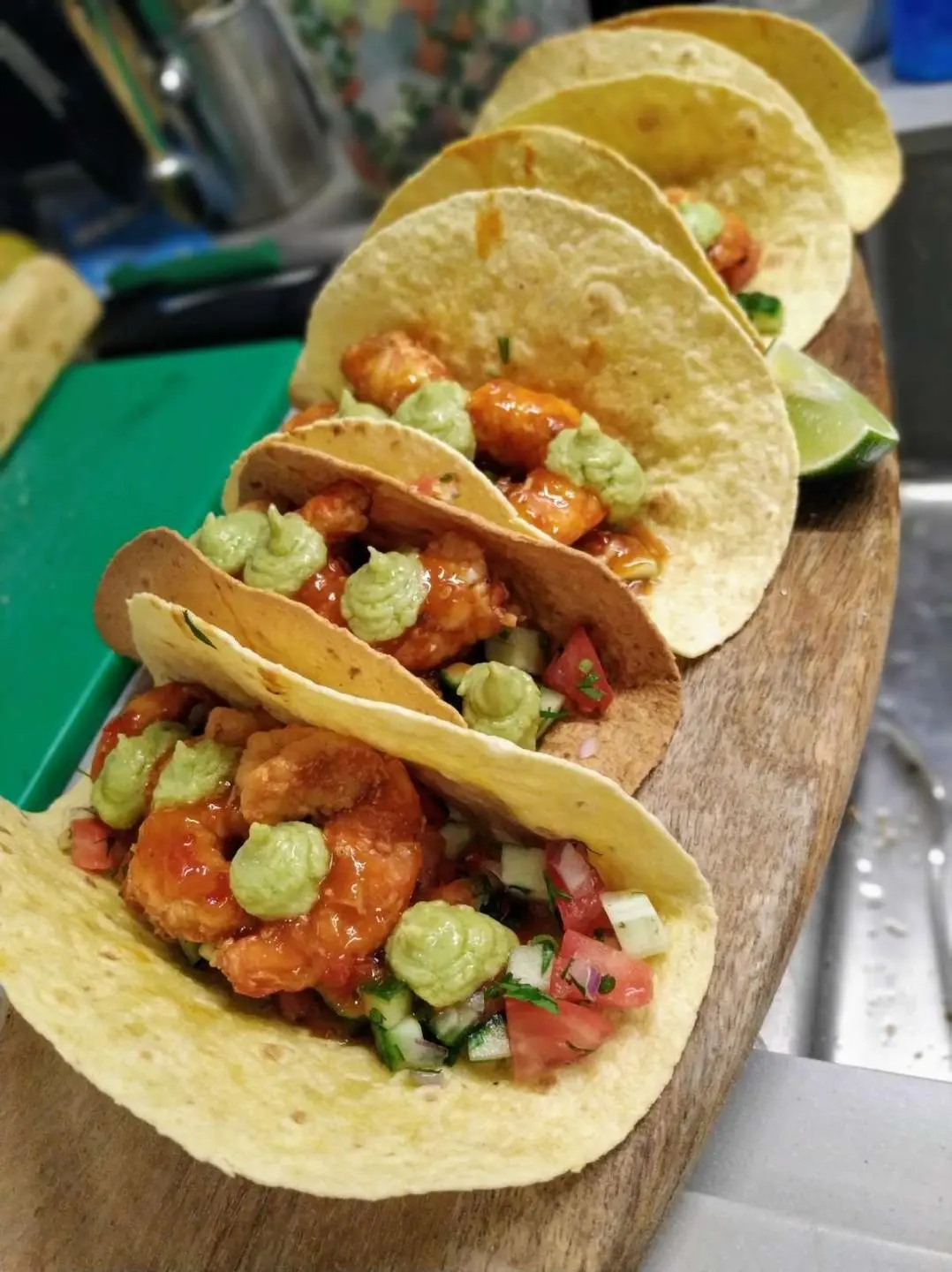 Atlantis yacht charter menu items served on a boat deck with greens and sauces