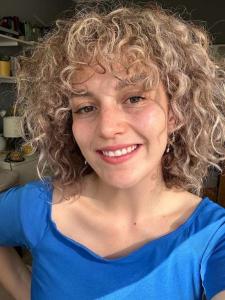 Smiling Curly Haired Woman Closeup