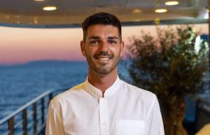 Smiling Crew Member Yacht Sunset