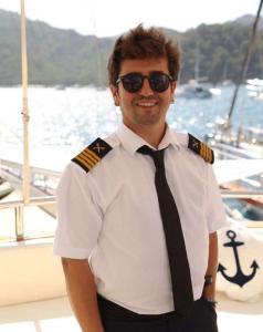 Crew Captain Smiling On Yacht Deck