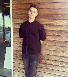 Crew Member Chef Standing By Wooden Wall