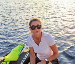 Woman With Sea Doo On Sunlit Water