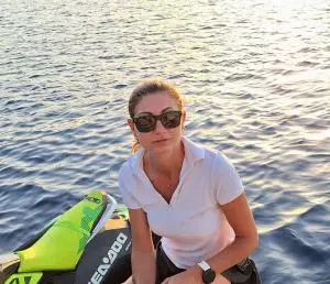 Woman With Sea Doo On Sunlit Water