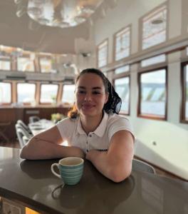 Young Woman On Yacht Counter Striped Mug