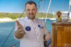 Crew Chef On Yacht Deck Reaching Hand