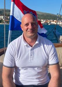 Bald Man On Yacht Croatian Flag