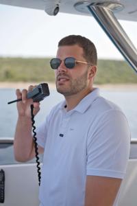 Crew Member Speaking Into Vhf Radio
