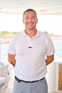 Smiling Crew Member Quantum Polo