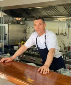 Chef Leaning On Kitchen Counter