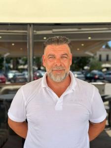 Man In White Polo Outdoors