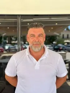 Man In White Polo Outdoors
