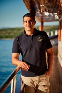 Crew Member Luna Polo On Yacht Rail