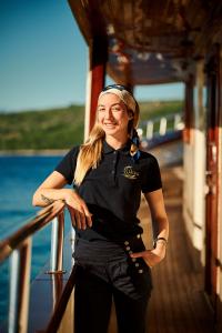 Female Crew Member On Yacht Deck