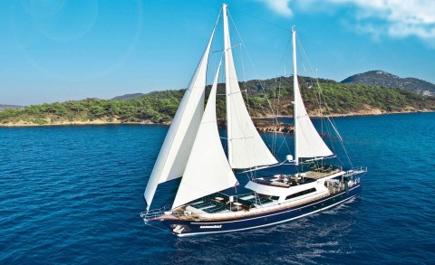 Maske 2 gulet sailing boat with white sails on blue sea