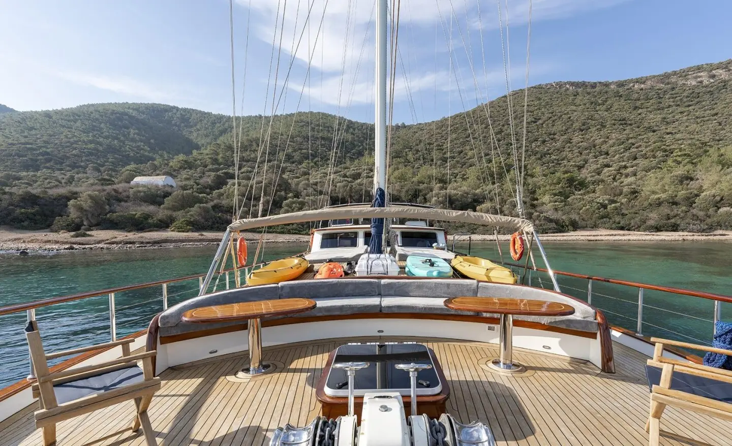 View from the yacht bow deck with seating and lifebuoys on both sides