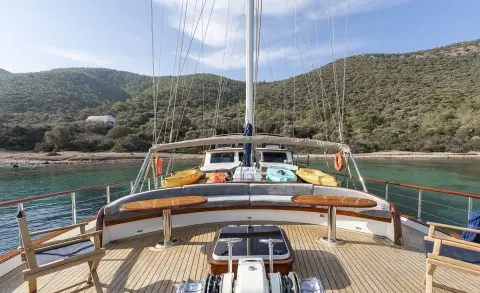 View from the yacht bow deck with seating and lifebuoys on both sides