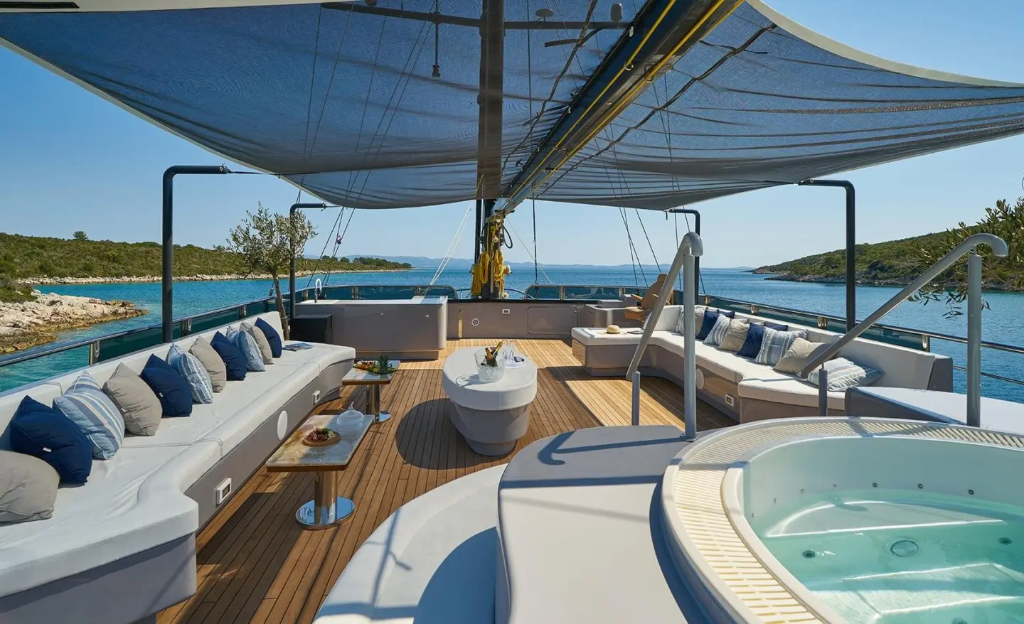 Sun deck aboard gulet Rara Avis with seating, shade canopy, and ocean view