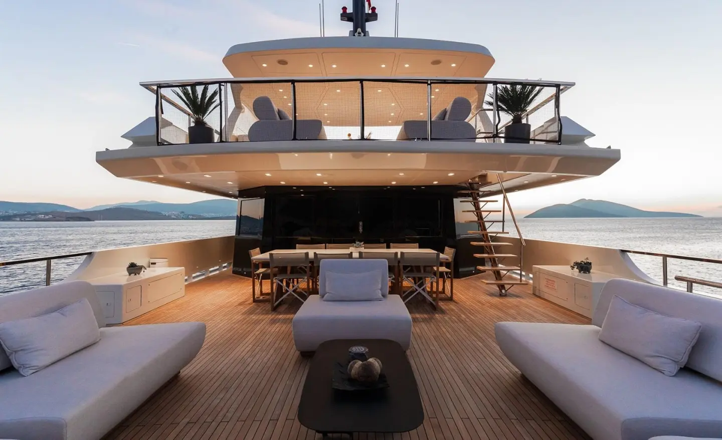 Illusion II aft deck view with seating, railings, and water beyond