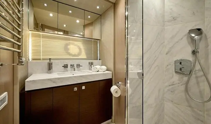 Master cabin with king bed, ensuite bathroom visible on yacht Hideaway