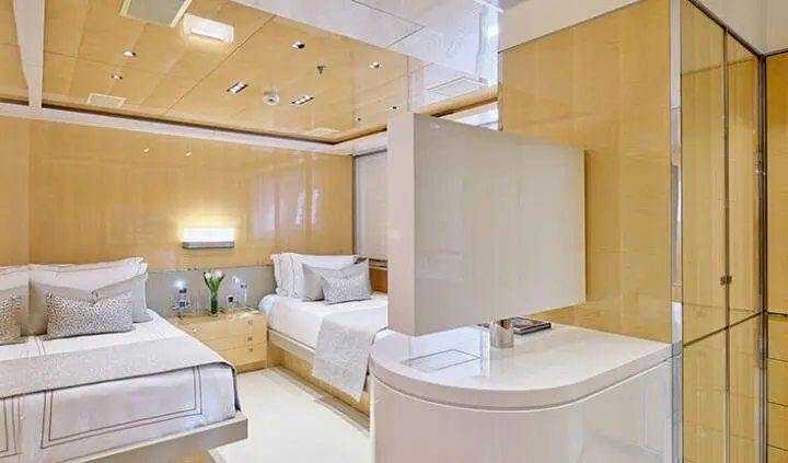Interior of La Pellegrina 1 cabin yacht with bed, seating, and wooden accents