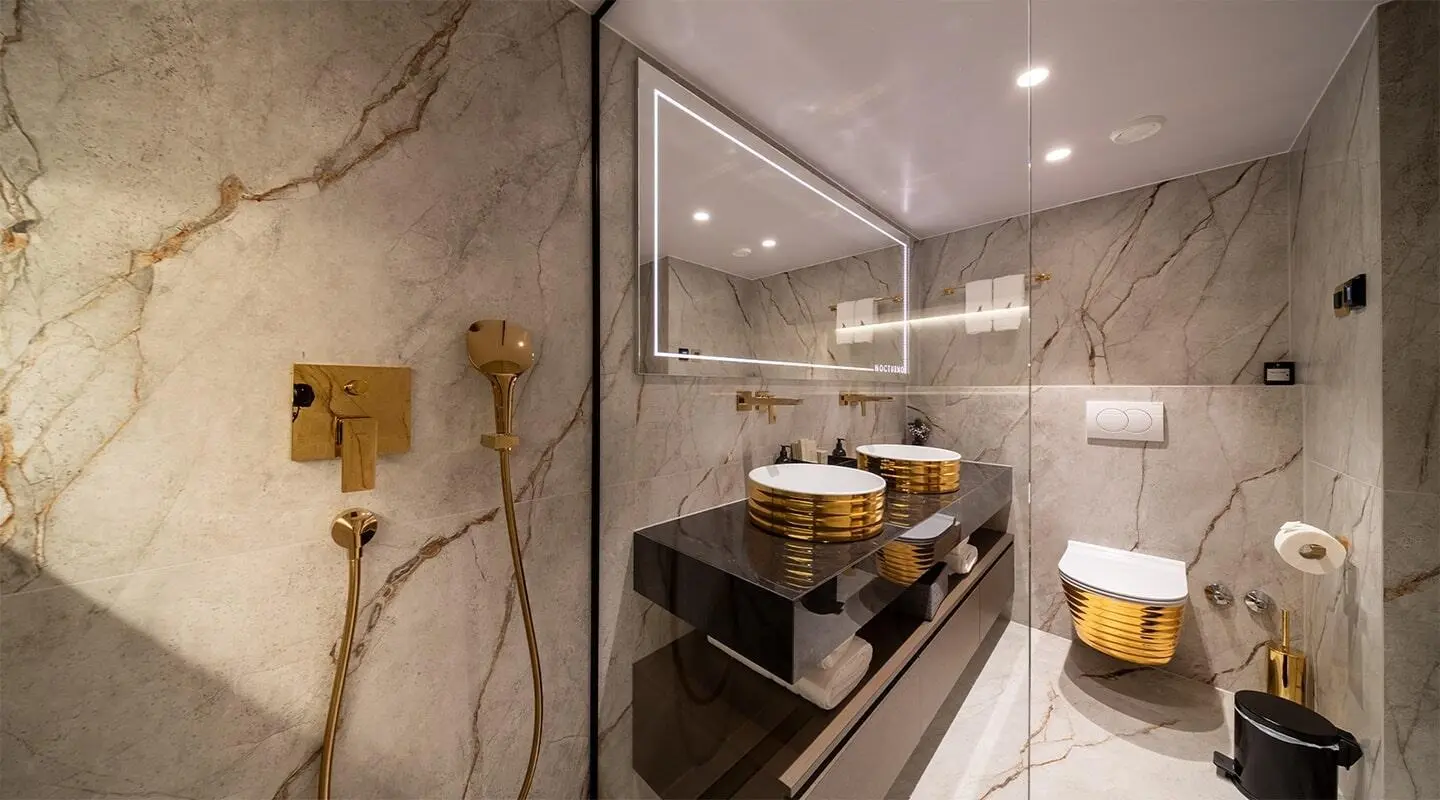 Interior of Nocturno yacht bathroom with sink, mirror, and towels