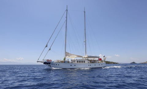 Gazella luxury 25m sailing yacht on blue sea with sails stowed and Turkish flag visible