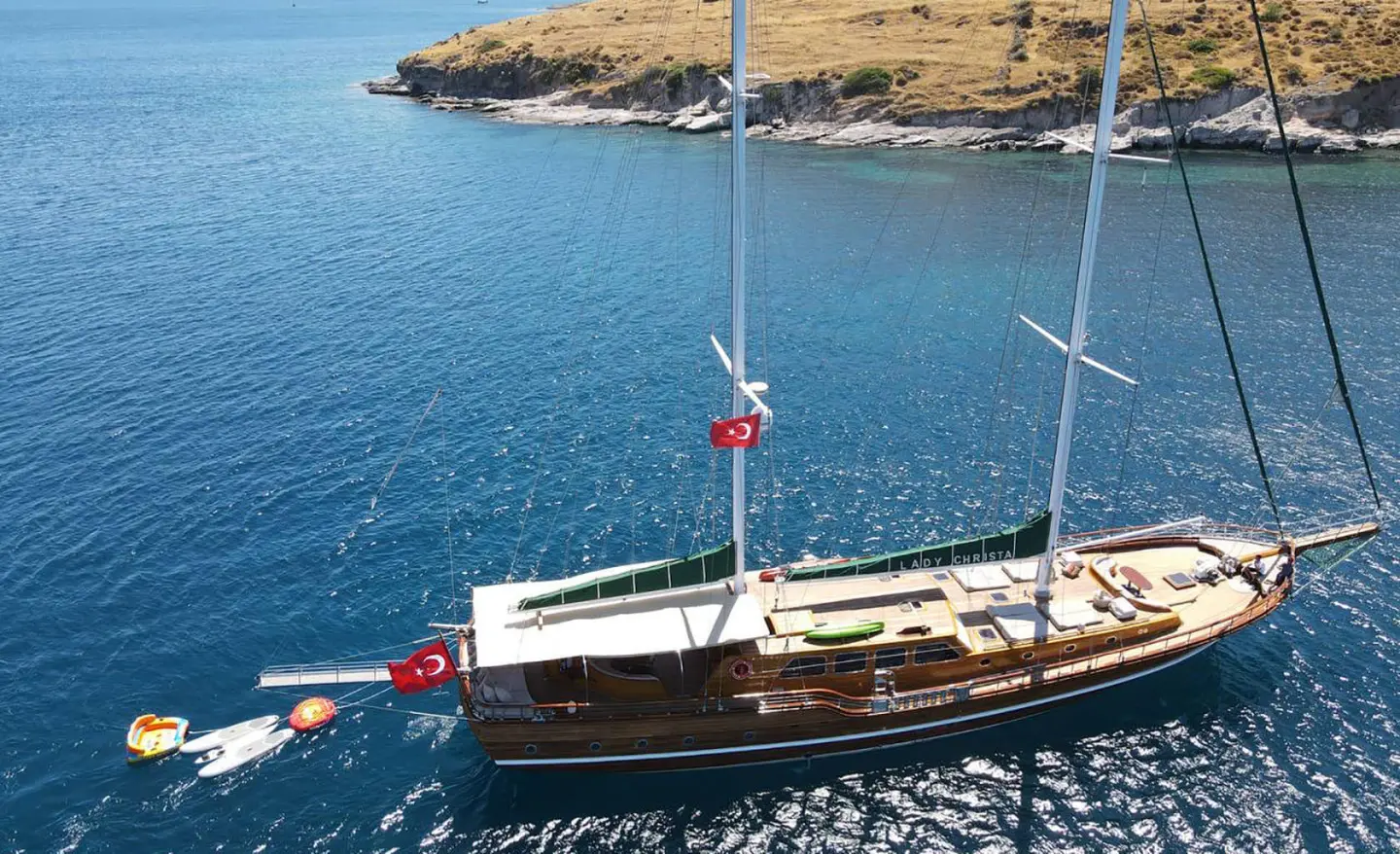 Tall wooden gulet Lady Christa sailing on calm blue water