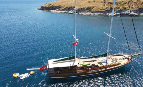 Tall wooden gulet Lady Christa sailing on calm blue water