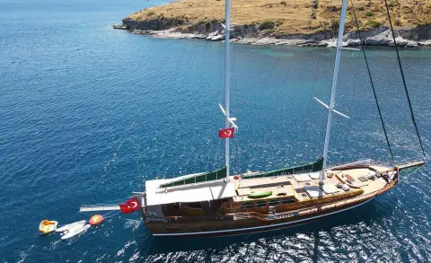Tall wooden gulet Lady Christa sailing on calm blue water