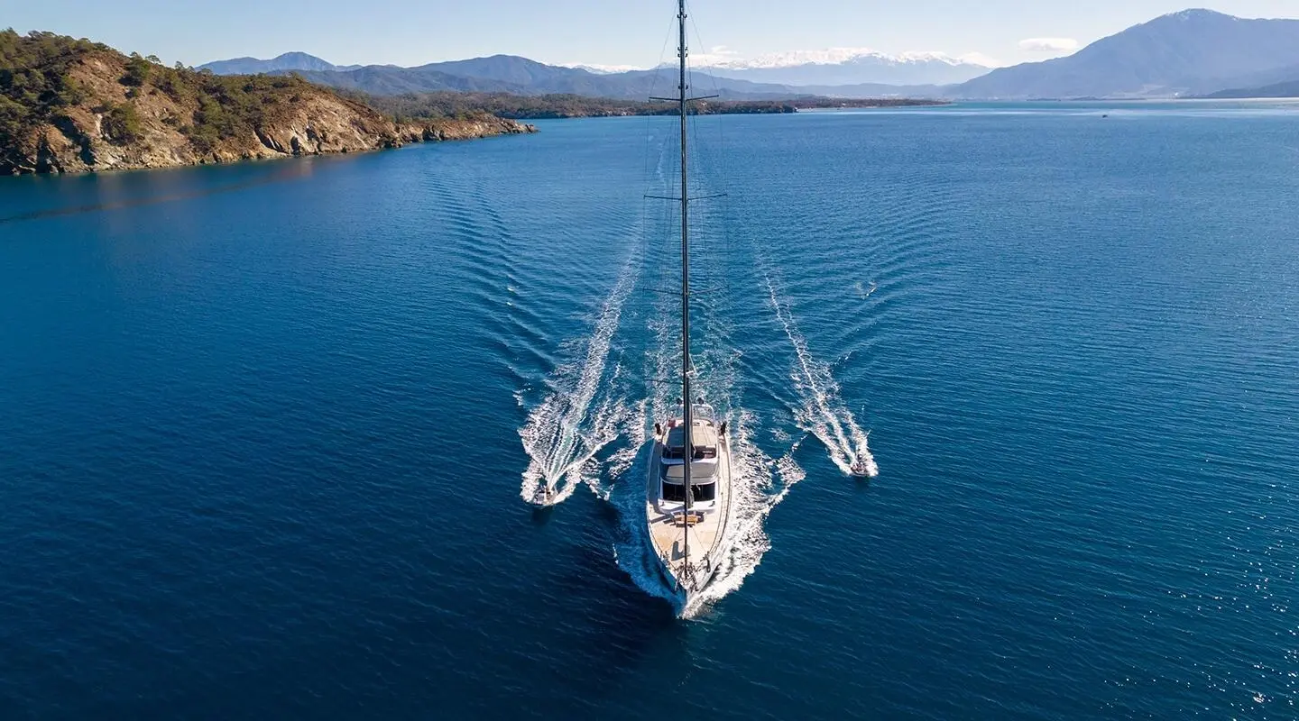 Overhead view of a luxury gulet yacht 'Long Island' sailing in calm blue sea at sunset