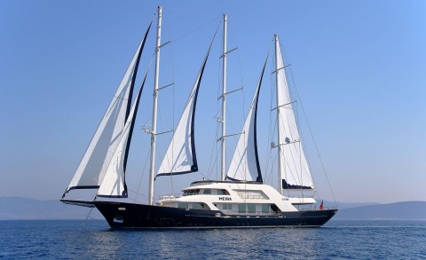 Meira yacht with four-masted sailing rig on open sea, deck and windows visible