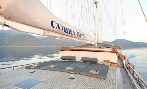 Sailing yacht Cobra King at sunset with deck details and rigging visible