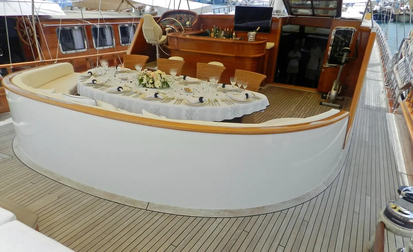 Aft deck of Kaya Guneri 4 gulet with polished wood, lifebuoys, and seating