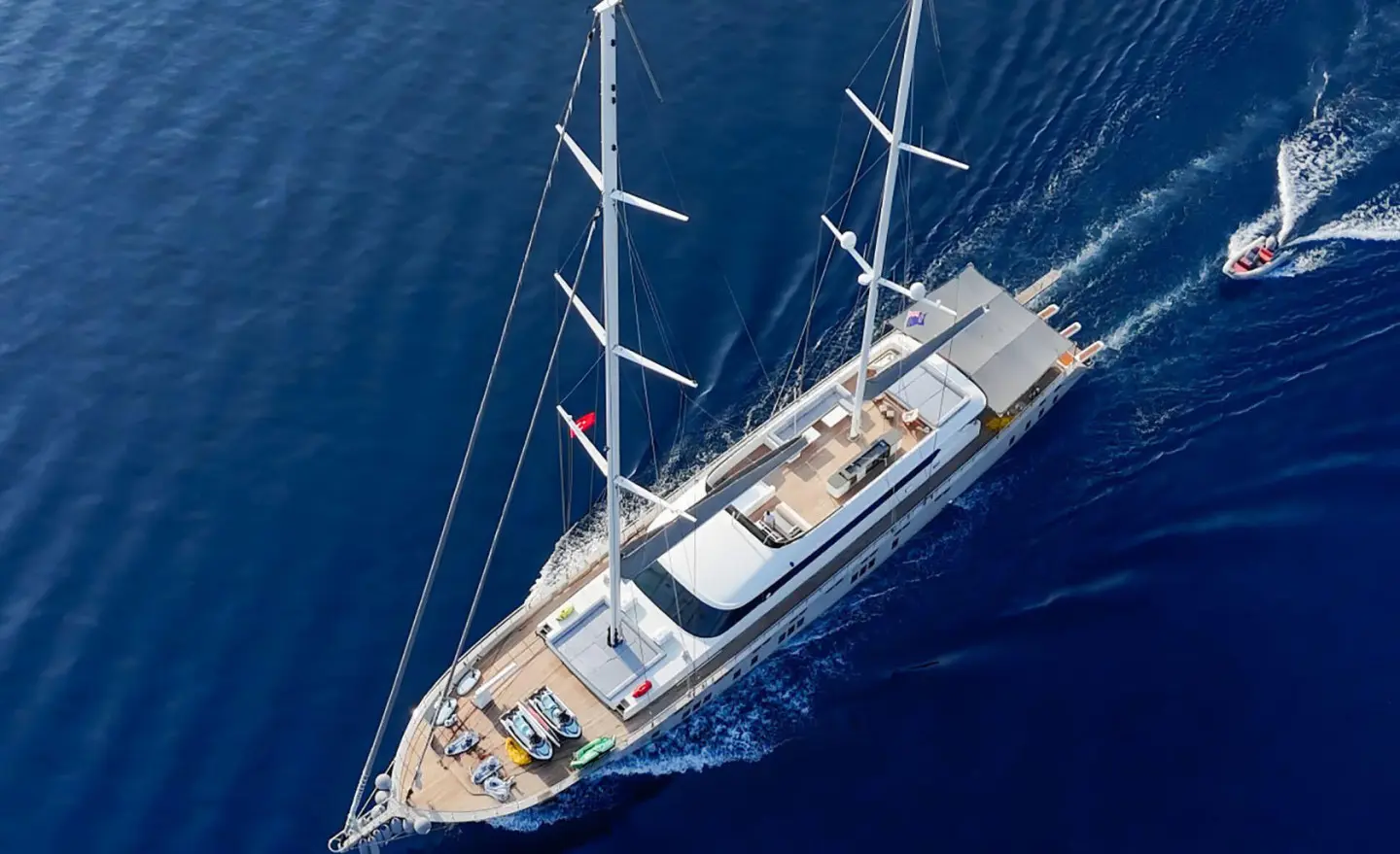 Aerial view of a luxury sailing yacht De Love anchored in deep blue sea