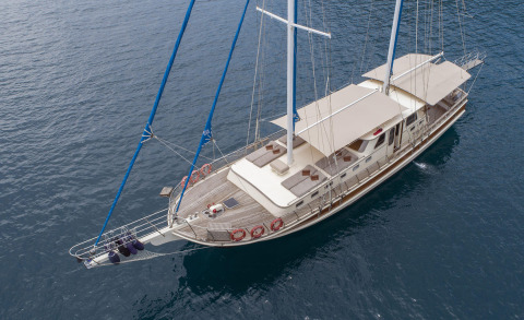 Overhead view of Faralya luxury sailing yacht with sunbathing cushions on the deck