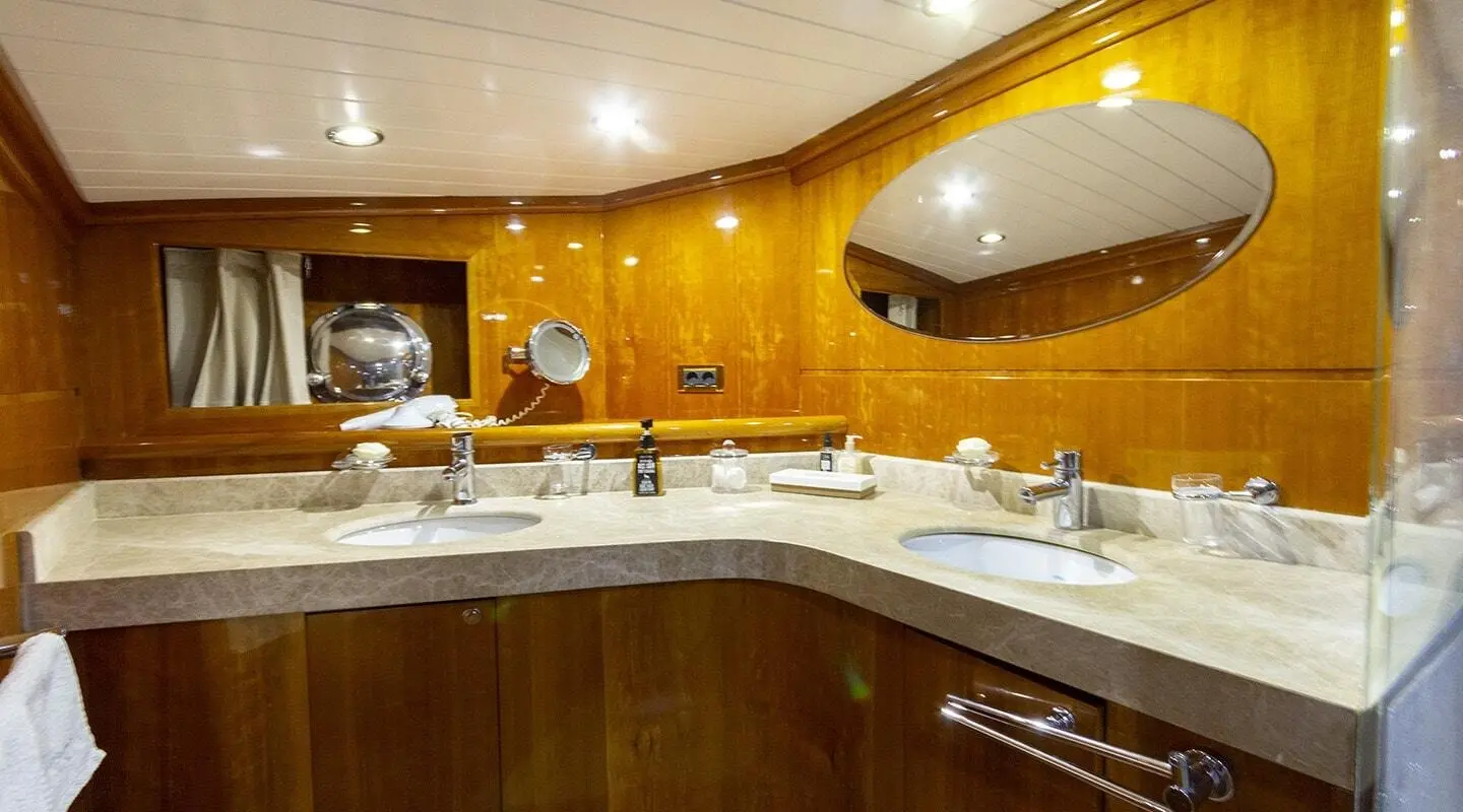 Luxurious yacht galley aboard Silver Moon with wooden cabinets and polished counter