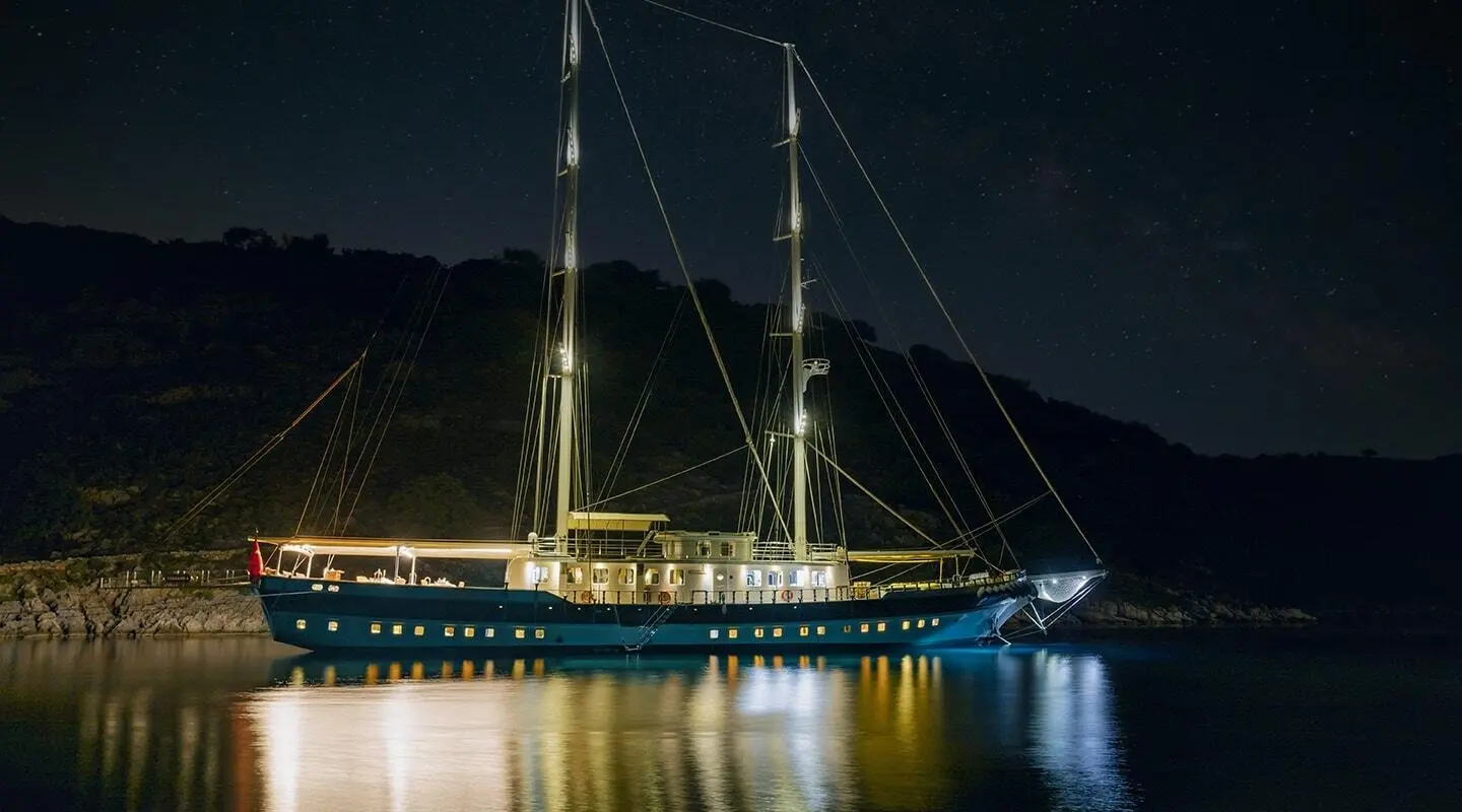 Tersane 8 luxury gulet at night with illuminated hull on calm water