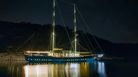 Tersane 8 luxury gulet at night with illuminated hull on calm water