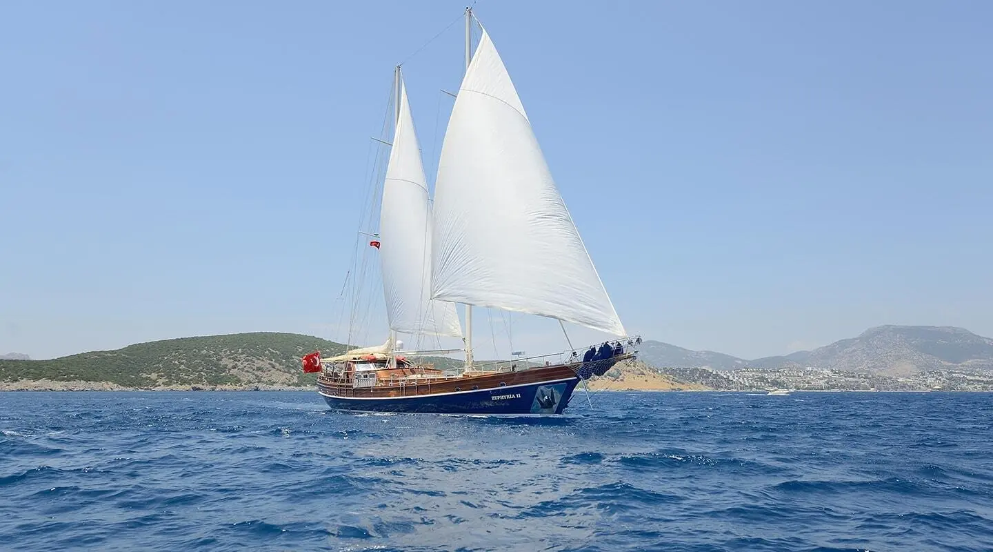 Gulet Zephyria II sails on blue sea with white sails raised