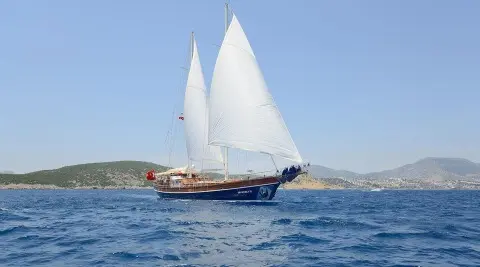 Gulet Zephyria II sails on blue sea with white sails raised