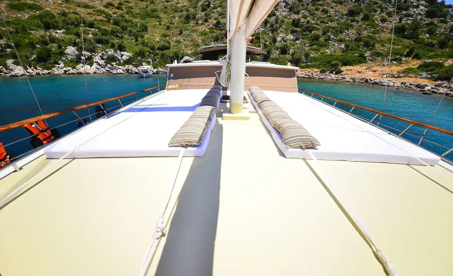 Sun deck of Prenses Bugce yacht with seating and shadows along the gunwale